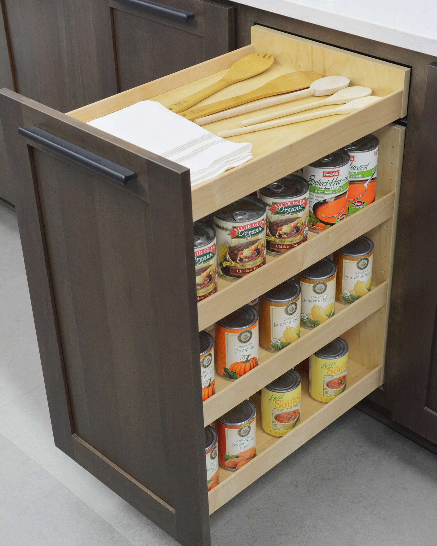 A Dura Supreme Base Pull-Out Pantry neatly stores row after row of pantry goods within a narrow space making it easy to see the entire contents of your pantry at a glance. (Available in wood or wire options)