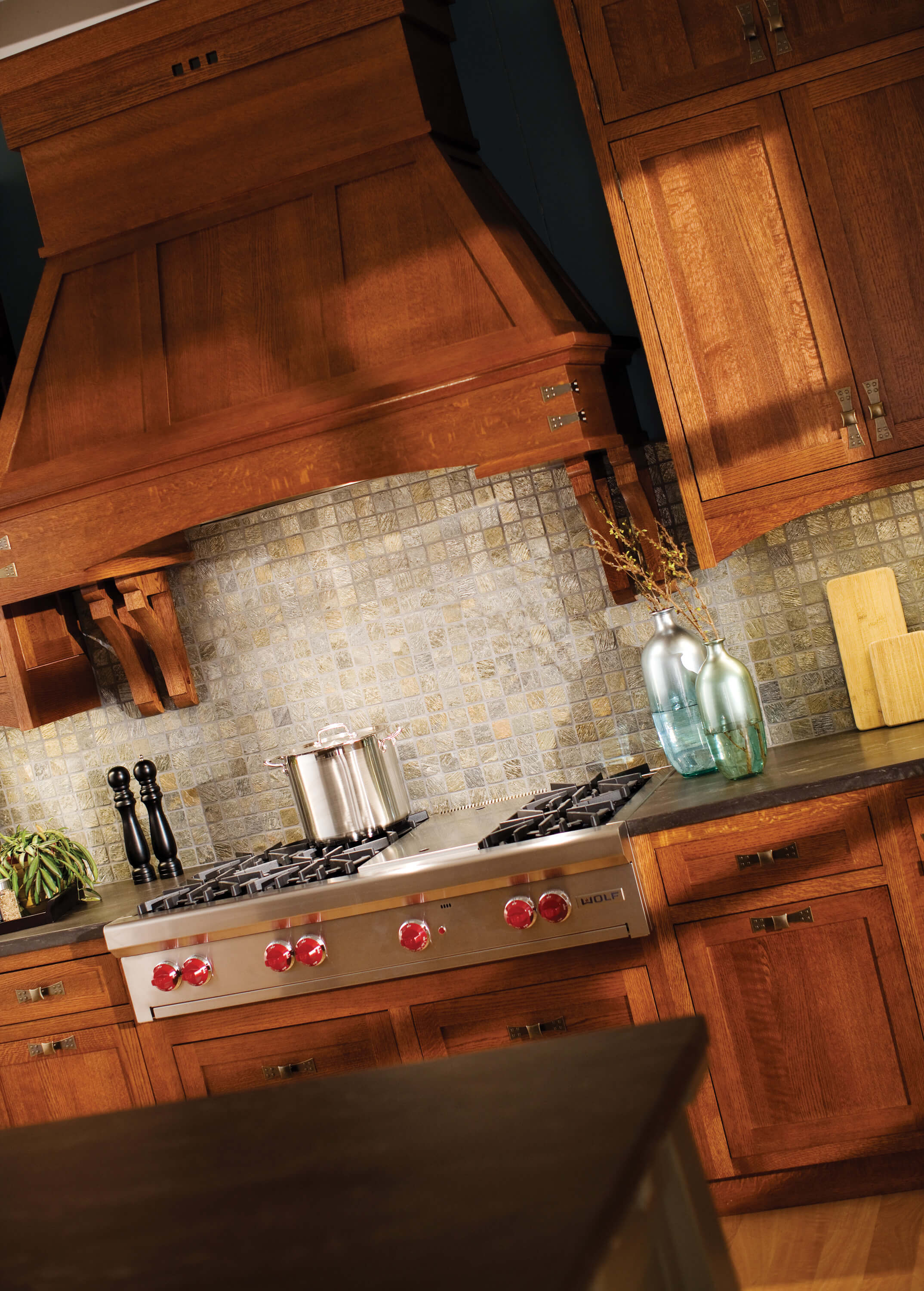 Wood hoods add a true hand-crafted focal point to a Craftsman style kitchen design.