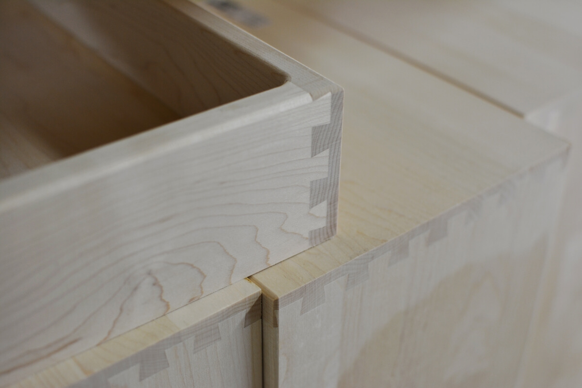 A cabinet drawer box with sleek dovetail joinery from Dura Supreme Cabinetry.