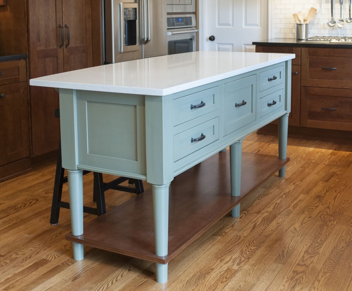 Design features like kitchen islands for example, tend to have a more furniture-styled look. Dura Supreme Cabinetry design by The Kitchen Studio at Pine Street Carpenters Inc.