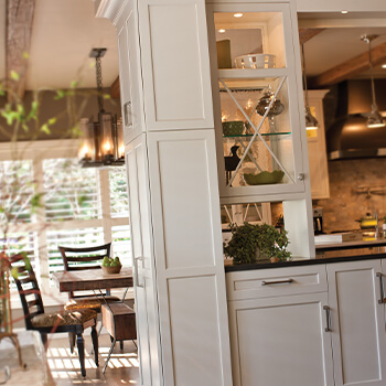 Bria Cabinetry is a full-access kitchen cabinet brand from Dura Supreme Cabinetry. Shown here in a transitional style kitchen design with white painted full overlay cabinet doors.