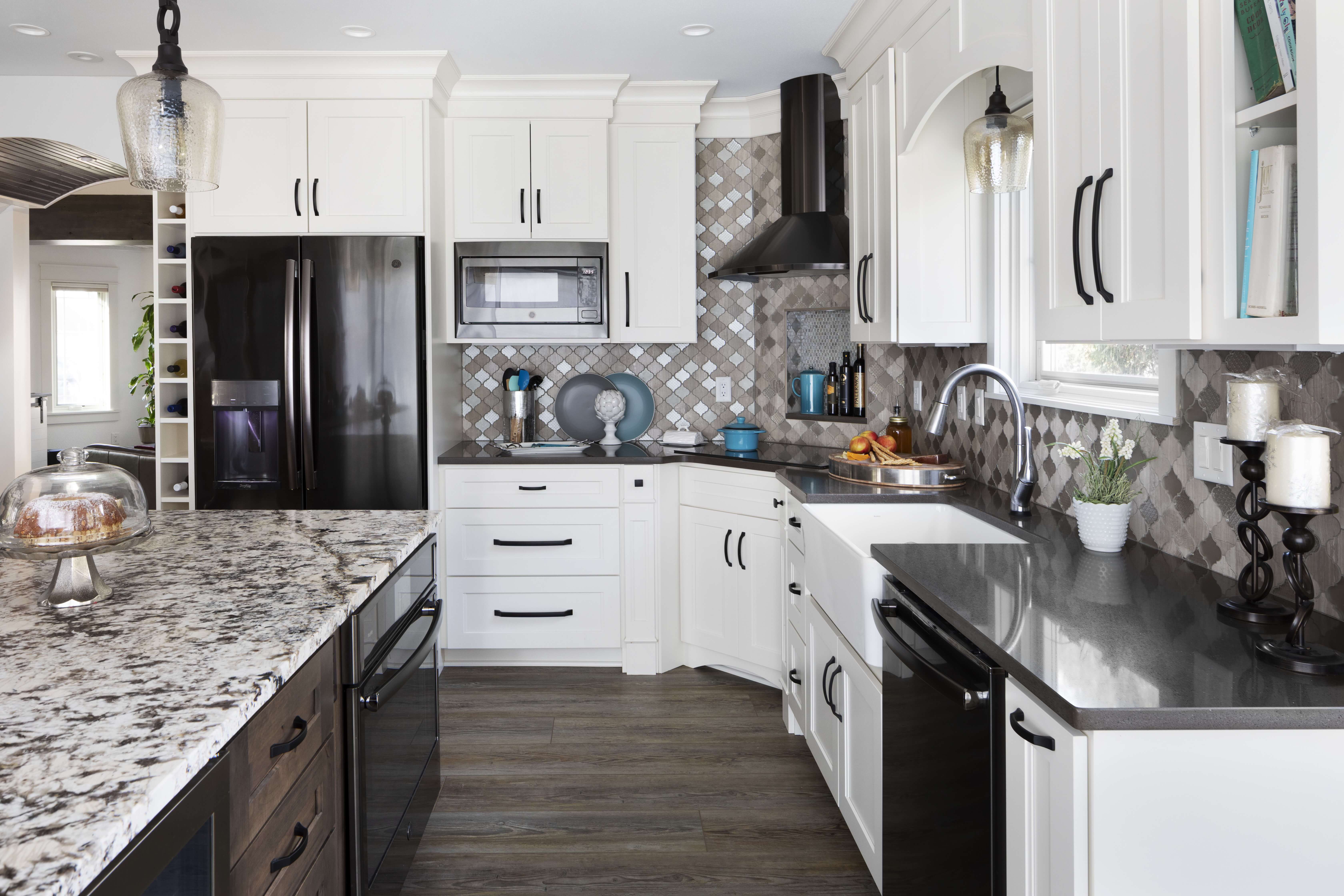 grey kitchen wall with black appliances