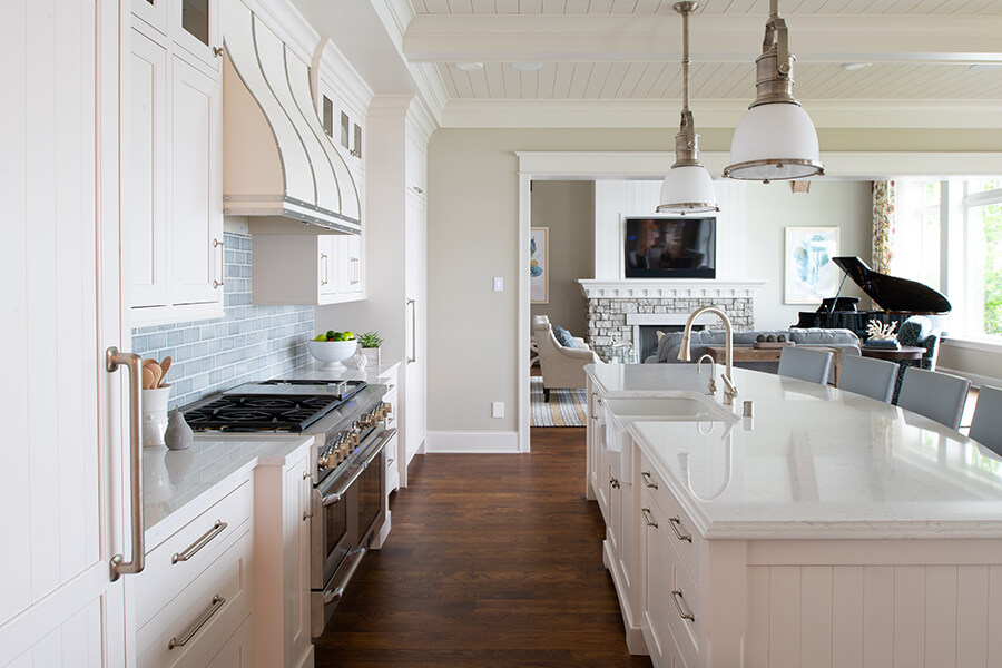 Inset cabinetry, available with Crestwood, is a distinctive look inspired by early American furniture-makers and offers an authentic, hand-crafted look with timeless appeal. This coastal style kitchen design features white painted inset cabinet from the Crestwood Cabinetry product line by Dura Supreme.