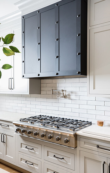 A beautiful kitchen remodel with painted kitchen cabinets from Dura Supreme Cabinetry. Learn about kitchen design before remodeling your kitchen with new cabinets.