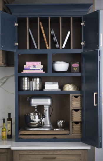 A custom larder was crafted to create the perfect baking center. Featuring Dura Supreme's Morel stain on Hickory and Gale Force Personal Paint Match finish.