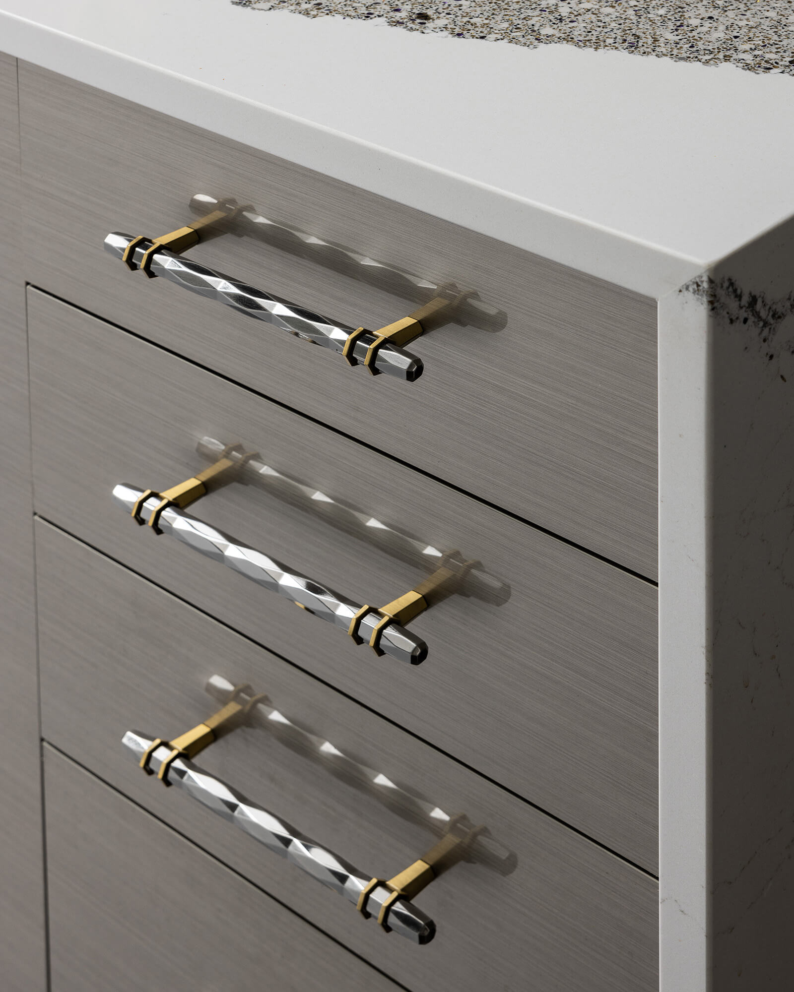 Talia-Horizontal cabinet door in Wired Mercury Gloss Foil showcases a sleek horizontal grain pattern with a luminous metallic-inspired finish. The glossy slab door surface reflects light beautifully, creating a sophisticated, high-tech look for contemporary custom cabinets.