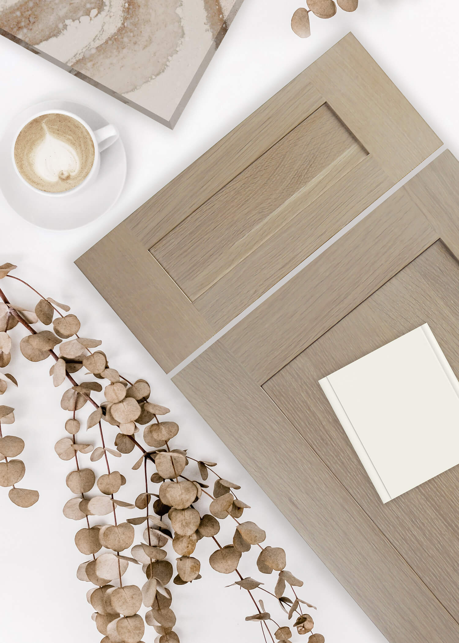 A true-brown stained cabinet door with a shallow, skinny shaker style paired with an off-white paint color with a nature inspired undertone.