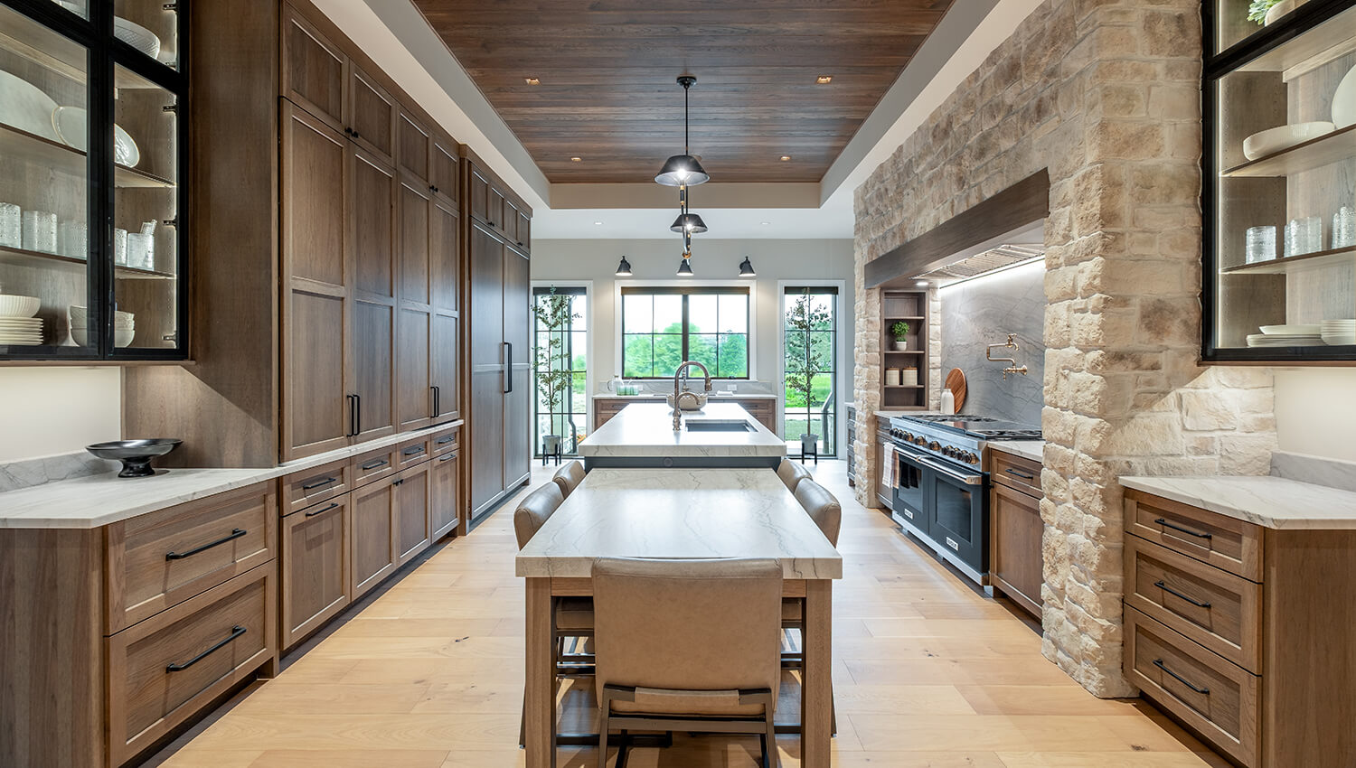 A galley styled kitchen featuring a medium true brown stained finish on hickory cabinets.