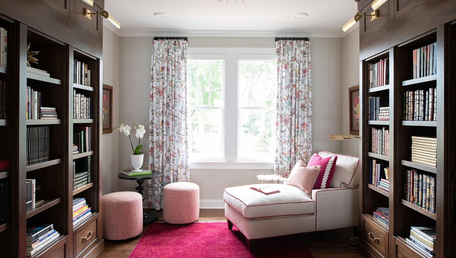 This delightful home library is a beautiful space to dive into a good book. The built-in bookcases by Dura Supreme are designed with the Campbell standard overlay door style in the Heirloom “O” finish on Cherry. 