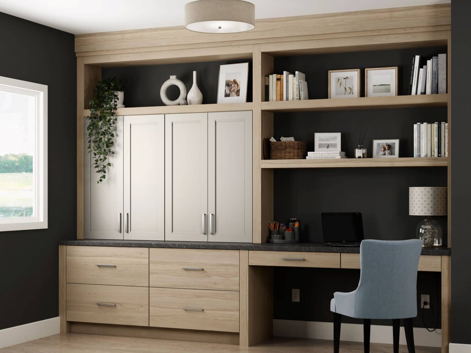 The Dura Supreme office cabinets and built-in desk feature a combination of a slab door style in light stain on the Hickory wood cabinets paired with a detailed flat panel door style in a natural off-white painted finish. This built-in desk and office cabinets were customized to fit the homeowners needs for working from home.