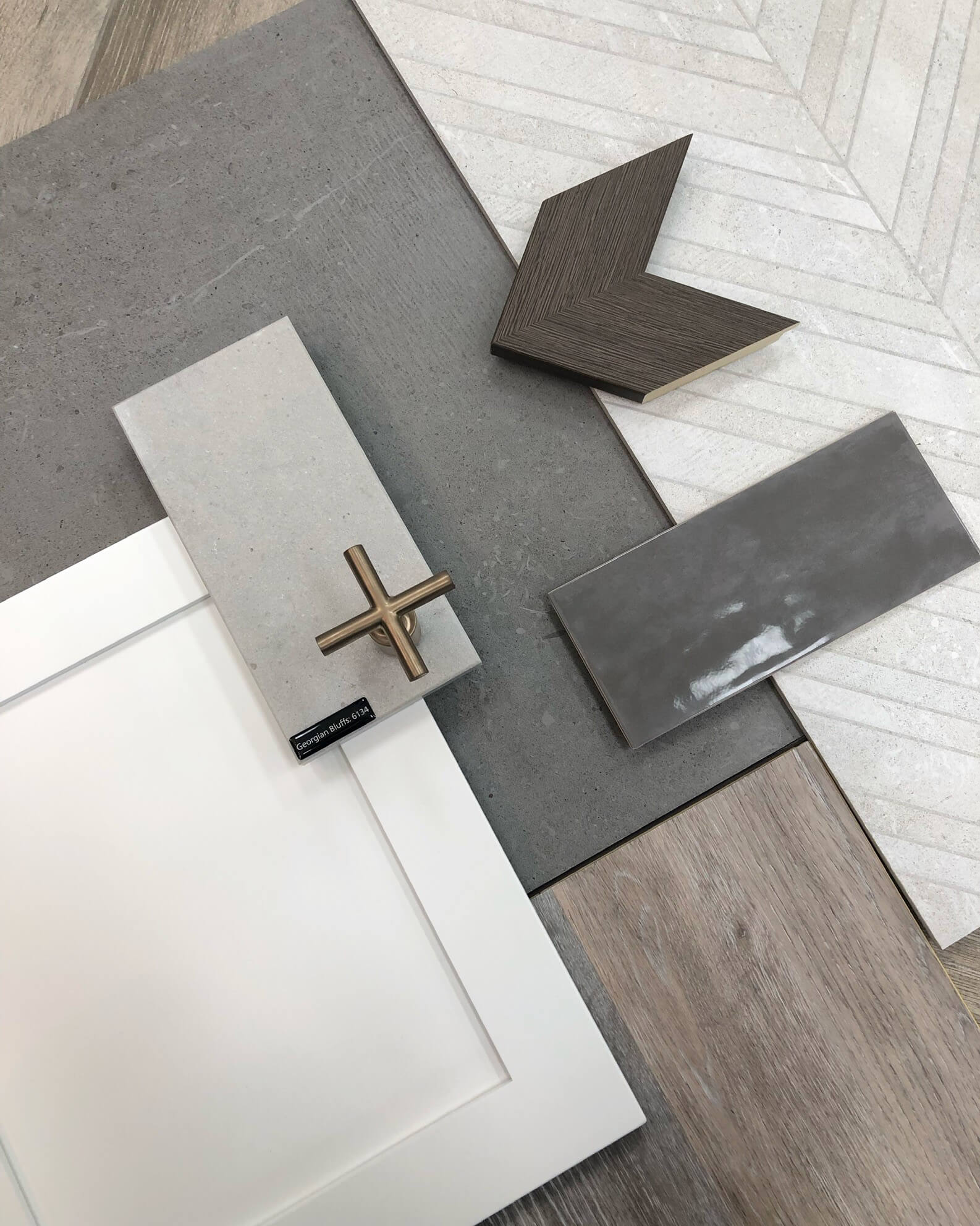 A modern farmhouse flat lay displays a mood board for an upcoming kitchen design.