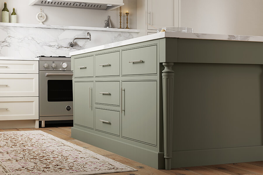 Trendy green kitchen island cabinets with slab inset doors.