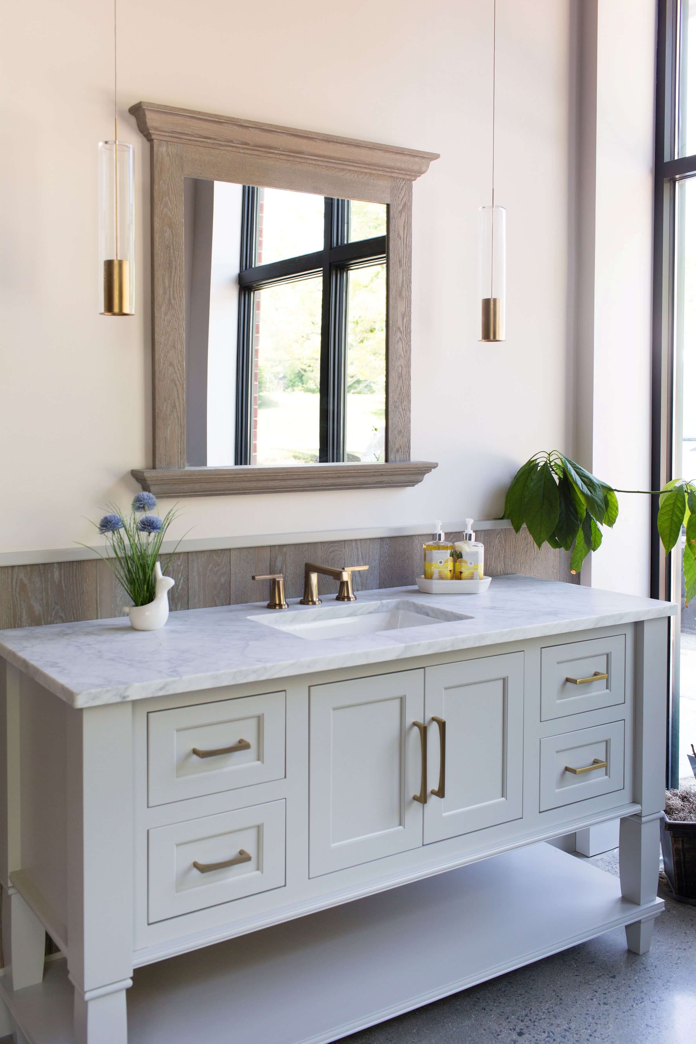 An off-white, light gray vanity from Dura Supreme's Bath Furniture Collection.