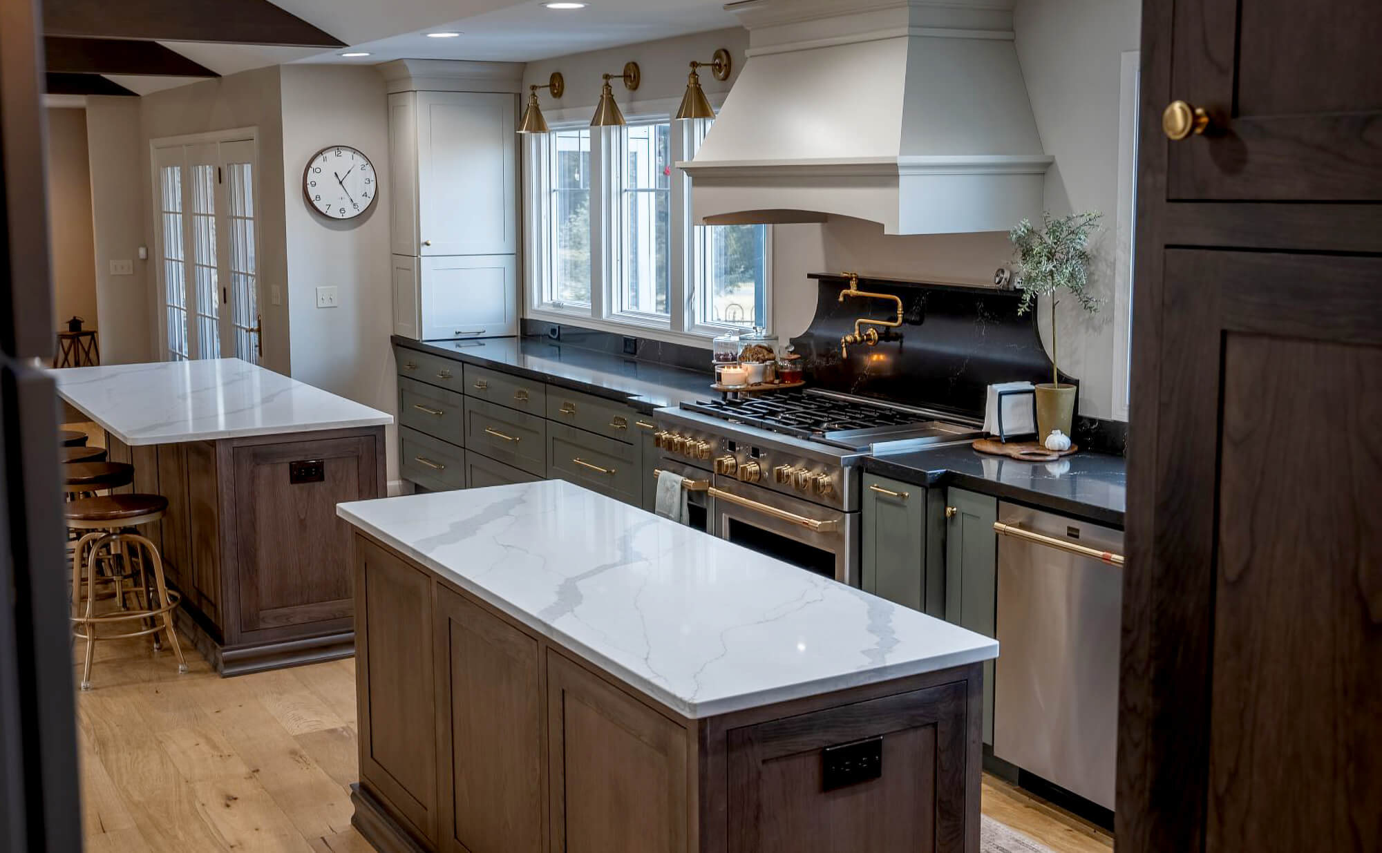 A new kitchen remodel with two kitchen islands in a row.