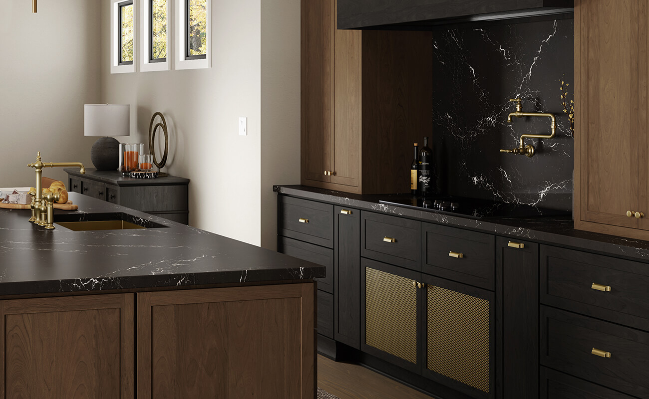 Shallow railed, micro shaker cabinets in a black stained finish with gold wire mesh inserts. Contrasted by true-brown stained shaker cabinets.